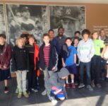 Geo takes pictures with visiting class to the Yogi Berra Museum